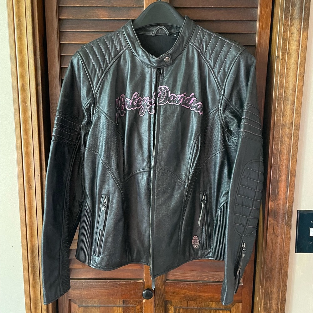 Brand new Harley Davidson leather jacket. Size 1w womens. Purple detailing.